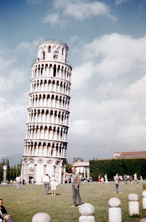 Charles holding up Leaning Tower of Pisa in Pisa, Italy