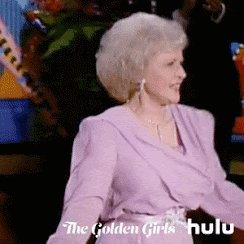 Betty White, as Rose from the Golden Girls, is strutting around a dance floor in front of an audience. She's shimmying and swaying, and performing.
