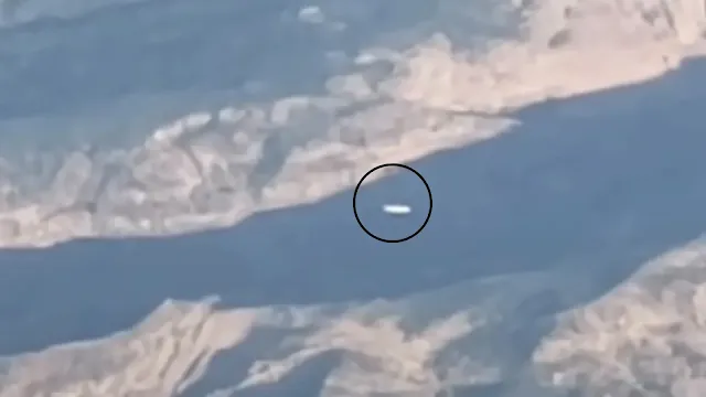 Real UFO sighting that was filmed from the window of an airplane by the eye witness over South America.