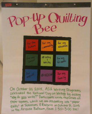 Photo of a sign announcing a "pop-up quilting bee" at FemRhet 2015.