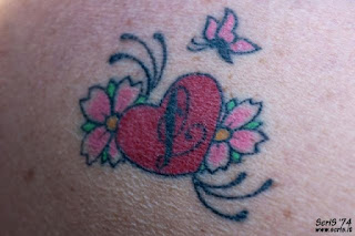 flower heart tattoos