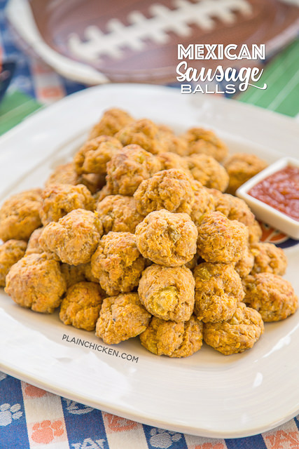 Mexican Sausage Balls - our favorite sausage balls kicked up with taco seasoning and green chiles. Can make ahead of time and freeze unbaked for a quick snack later. Serve with some salsa or a mixture of salsa and ranch. SO GOOD!!! These things fly off the plate at parties! Perfect for tailgating!! We love this easy Mexican appetizer recipe!