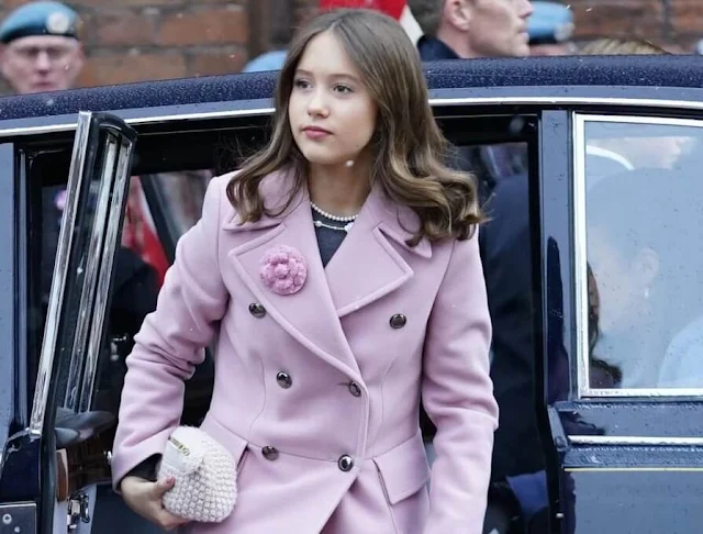 Princess Isabella wore a blue coat by Prada, Princess Josephine wore a pink coat by Andiata, Queen Mary wore a blue coat dress