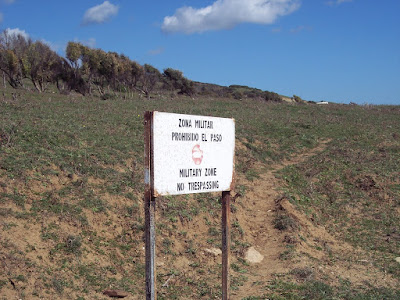 Warning sign on the cliff side of Tarifa