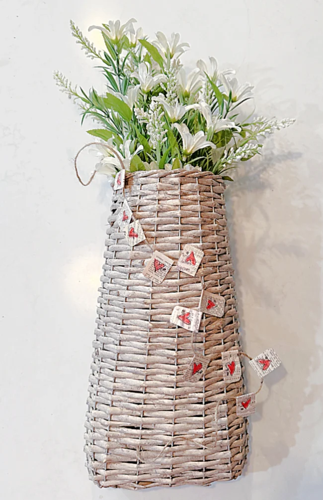 basket of flowers with heart garland