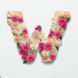 The letter W is embellished with beautiful roses in pink, yellow, and white colors