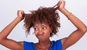 Common Habits That Damage Your Hair: How to Protect and Improve Your Hair Health A lady pulling her damaged hair