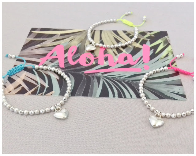 http://www.eva-mae.co.uk/index.php/2013-04-07-20-16-53/bracelets/satin-bead-and-heart-charm-friendship-bracelet-neon-pink-detail