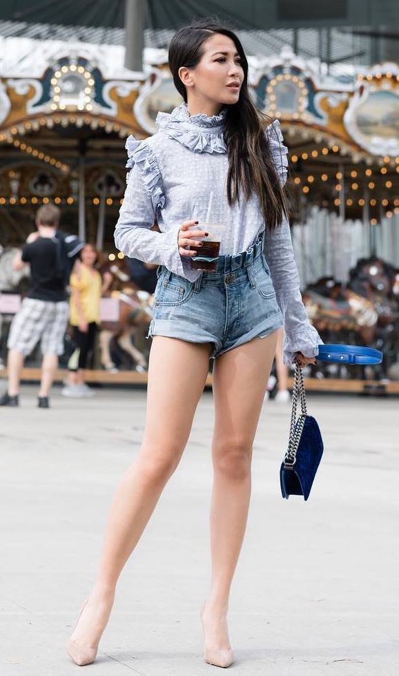 what to wear with a pair of denim shorts : black bag + nude heels + ruffle top