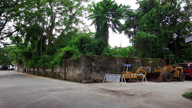 corner view of an empty lot with probably historical old thick concrete wall in Malitbog, Southern Leyte