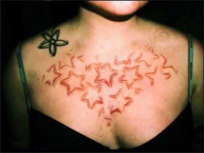 scarification tattoo. Horrible tattoo creations