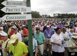 Spectators leave Augusta National Golf Course after play was suspended because of inclement weather during the par 3 competition at the Masters golf tournament Wednesday, April 4, 2012. 