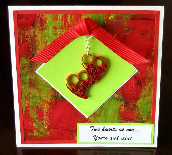 square handmade red and lime green valentine card with quilled hearts and red ribbon