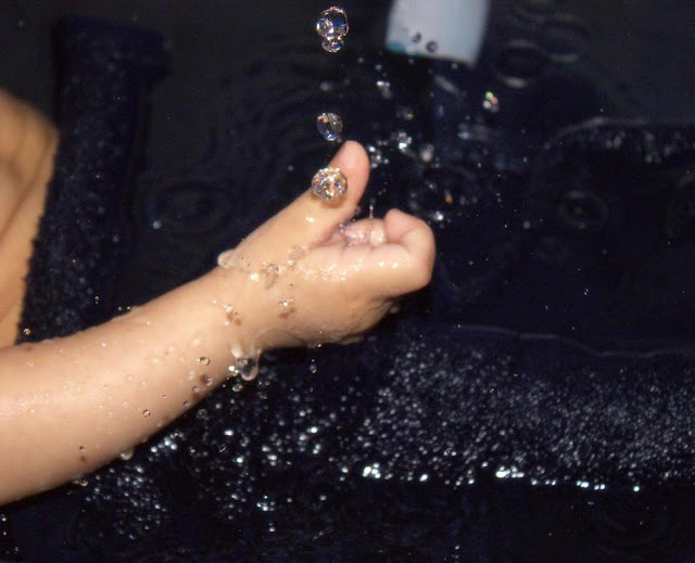 Baby playing with water