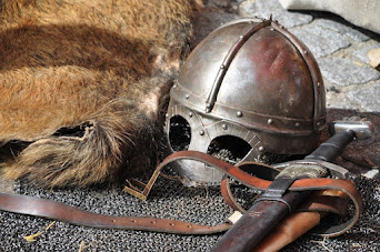 medieval helmet, armor, and sword