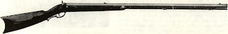 First rifle often pictured in Remington literature is actually percussion half-stock American sporter of 1840's and was made several decades after Eli Ir. founded gun firm. Cheekpiece on right as well as left of stock is sometimes found on Remingtonbuilt early rifles.