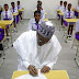 Photo: President Buhari pictured inside a class room in Edo state