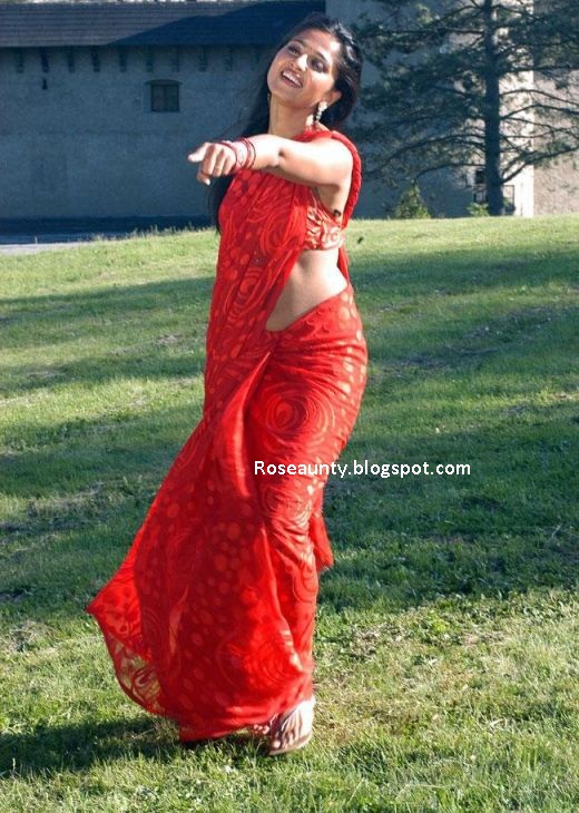 Anushka Shetty in wet saree showing navel