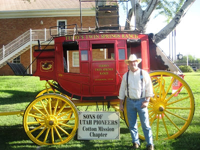 Roland Lee in front of Dean Terry's Stage Coach at Washington Cotton Days Festival