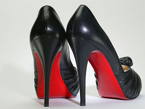 black shoes with red bottoms.77