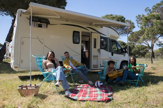 Family camping besides their RV