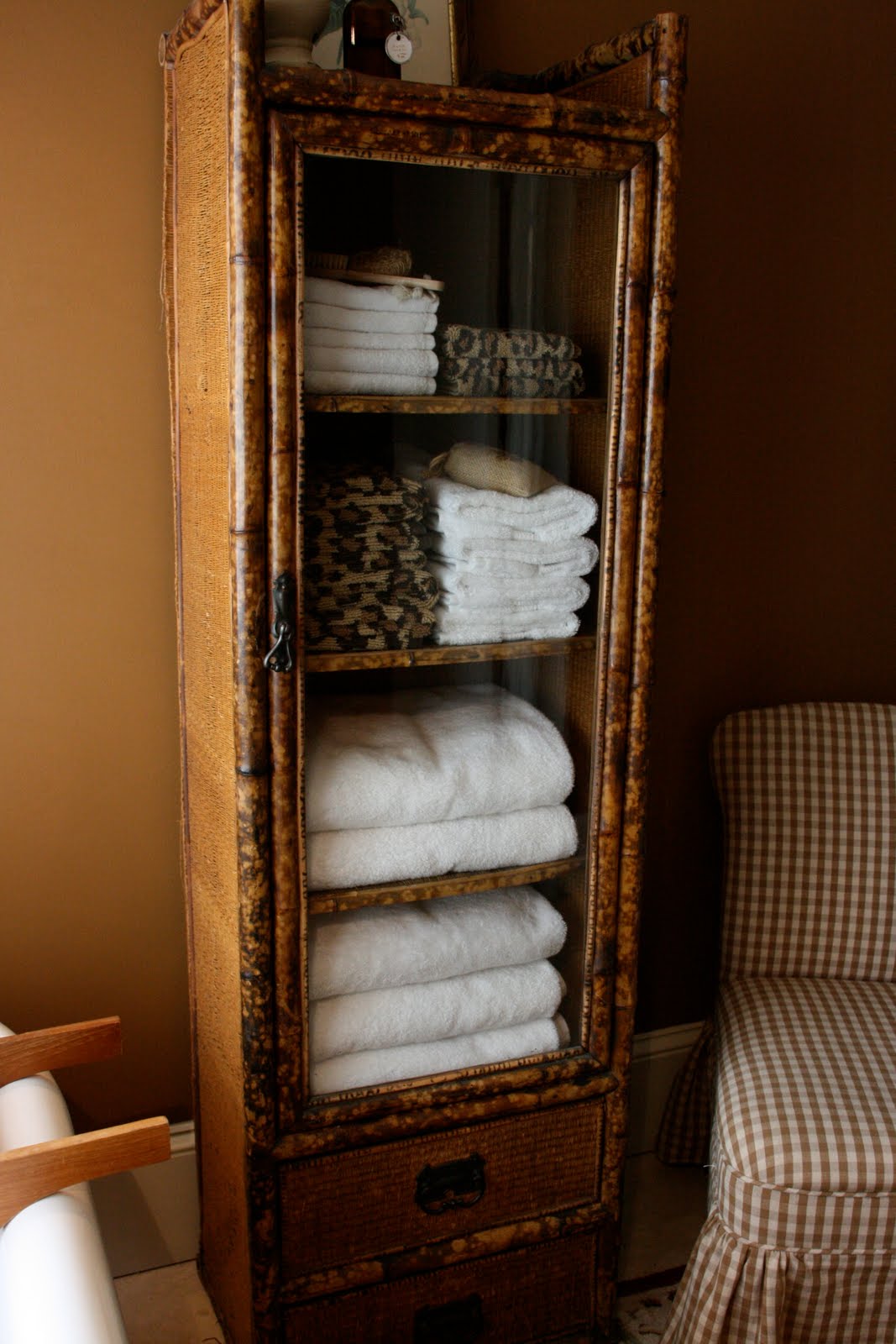 traditional bathroom lighting This faux bamboo cabiis currently my favorite piece of furniture.