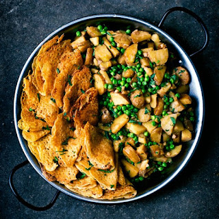 Easy vegan potato pea curry served with dosa.