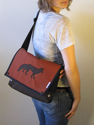 A portrait of an overshoulder handbag made of heavy nylon fabric with a fox as sewn by Aramee Diethelm