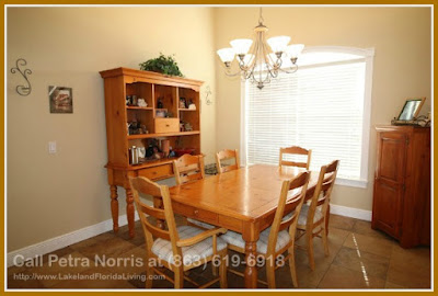 Feel the vibrant ambience while enjoying your dinner in the cozy dining room of this Winter Haven FL lakefront home for sale in Hart Lake Hills.