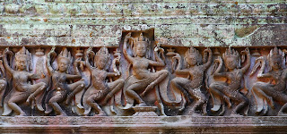 Dancing apsaras, divine damsels; South-East Asian temple carving 
