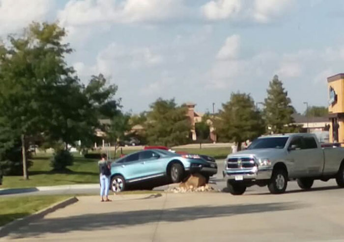 Someone Placed A Giant Stone To Prevent Drivers From Cutting The Corner, And The Results Were Hilarious