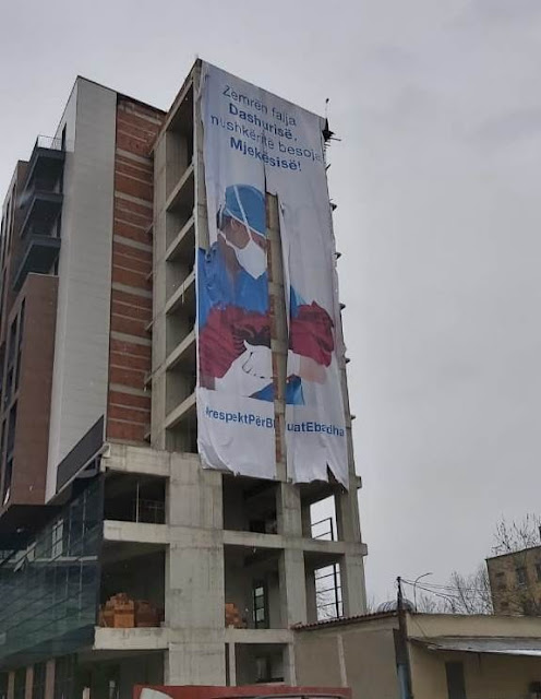 'Donate your heart to Love, entrust your Lungs to Medicine,' - giant banner covers Tirana palace