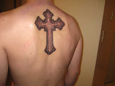 Cross on Back This was a very popular tattoo years ago but one we do not 