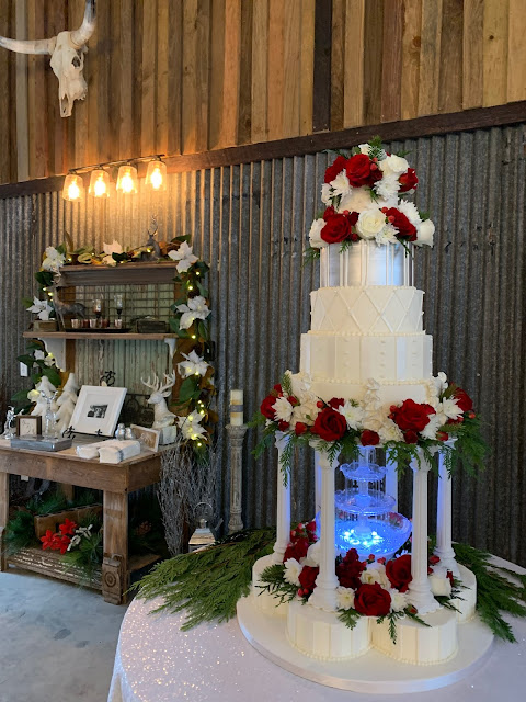 The Bride's Cake was a multi-level cake including a fountain and fresh flowers