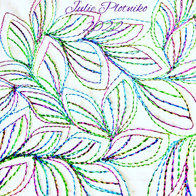 A leafy FMQ design in variegated green and purple