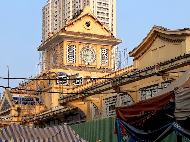 The architectural facade of Binh Tay Market building