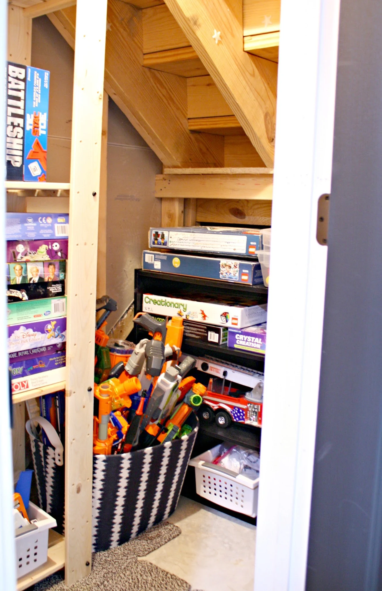 Toy closet under stairs