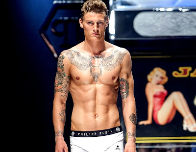 runway model with tattoos shirtless