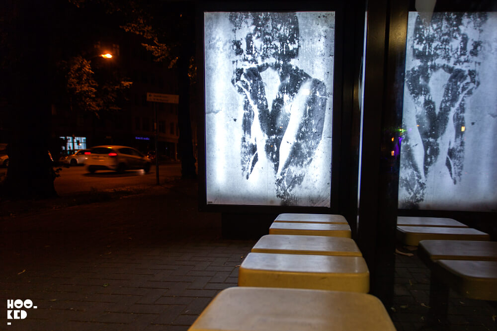 Berlin Street Art - Adbusting with artist Vermibus at night