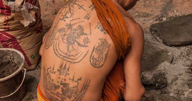 A Tattoo On The Shoulder Of A Buddhist Monk - SuperStock