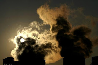 Smoke billows from a factory during sunset in the northern Spanish town of Torrelavega, March 12, 2005. (Credit: reuters.com / Victor Fraile) Click to Enlarge.