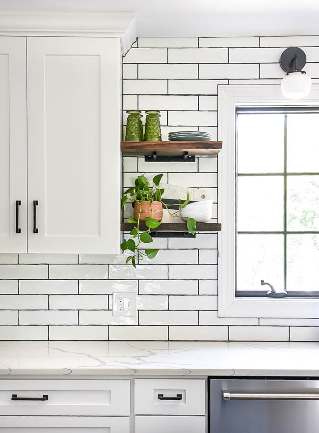 Vintage glasses on open kitchen shelves