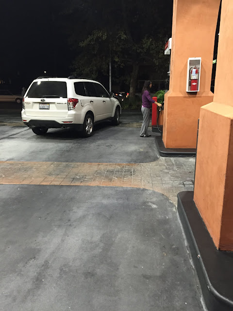 asian mom, funny mom, mom, fire extinguisher, gas station, filling up, suv, sweat pants, mom fashion, asian, asian lady, oriental, asiatica, asian ten