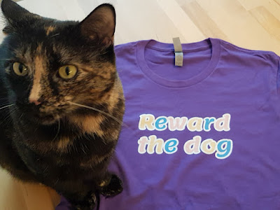 Reward the dog tee shirt, new Companion Animal Psychology merch, along with Melina the cat