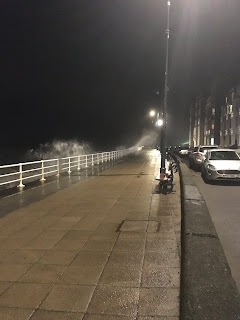 waves spraying the promenade