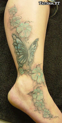 fotos de tatuagens de Borboletas na Perna com flores