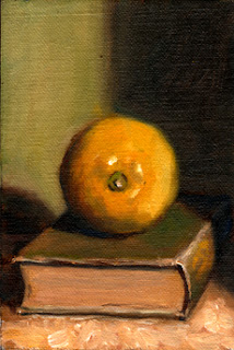 Oil painting of a lemon on an old green linen-bound book.