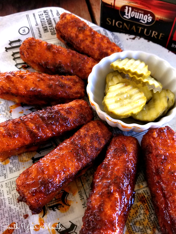 Nashville Hot Fish Fingers! An easy recipe for baked or air-fried fish fingers prepared the ‘Nashville Hot’ way, slathered in a spicy sauce then served with pickles and bread.