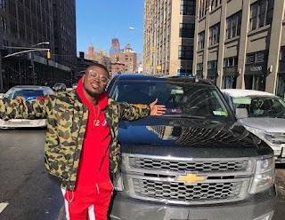 Jabrill Peppers posing for the picture with the car