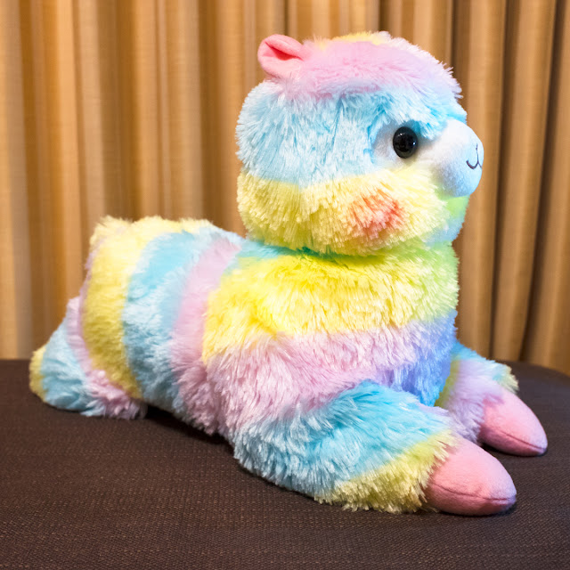 Alpacasso Tissue Box plushie in rainbow colors.